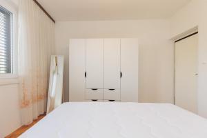 Łóżko lub łóżka w pokoju w obiekcie Buena Vida Apartman