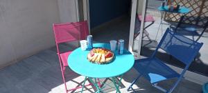 a table with a cake on top of it at Bedroom Agde 34300 in Agde
