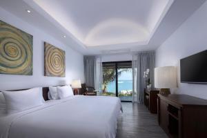 Tempat tidur dalam kamar di Celes Samui