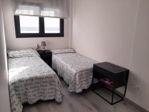 A bed or beds in a room at África View