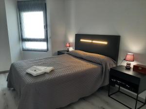 A bed or beds in a room at África View