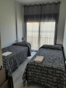 A bed or beds in a room at África View