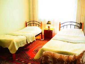 Postel nebo postele na pokoji v ubytování Baktygul guesthouse