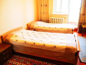 Postel nebo postele na pokoji v ubytování Baktygul guesthouse