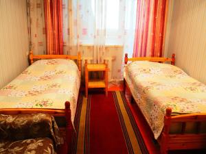 Postel nebo postele na pokoji v ubytování Baktygul guesthouse