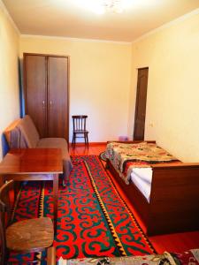 Postel nebo postele na pokoji v ubytování Baktygul guesthouse