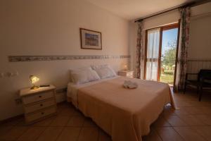 Posteľ alebo postele v izbe v ubytovaní Poggio delle Rose Tuscany Relais + 37 fotografií