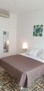A bed or beds in a room at CASA VACANZE PIAZZA MALTA