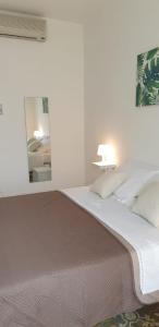 A bed or beds in a room at CASA VACANZE PIAZZA MALTA