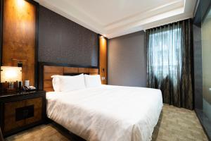 מיטה או מיטות בחדר ב-XINSHE Hotel - Linsen