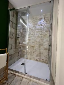a shower with a glass door in a bathroom at Le Marangi Getaway Suite in Martina Franca +45 photos