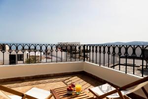 a balcony with a view of the ocean at Dar Tahendit in Tangier