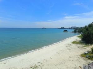 a view of a beach with a boat in the water at PD Paradise Lagoon North Penthouse B-2-4 in Kampong Baharu
