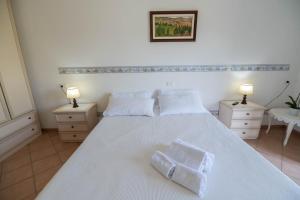 Posteľ alebo postele v izbe v ubytovaní Poggio delle Rose Tuscany Relais