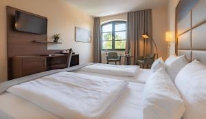Ліжко або ліжка в номері Hotel Ohlenhoff