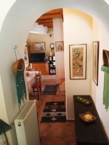 a living room with an archway and a dining room at Irene's loft in Ágios Matthaíos