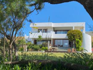 a villa with a view of the house at Svolis Beachhouse - Villa Set in a Beautiful Bay in Karistos