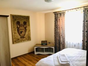 Ένα ή περισσότερα κρεβάτια σε δωμάτιο στο Apartament La Vilă