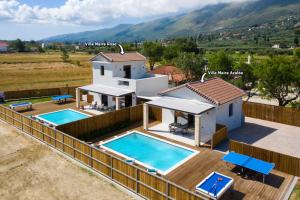 a villa with two swimming pools and a house at Villa Maira Azalea by Villa Plus in Katastárion
