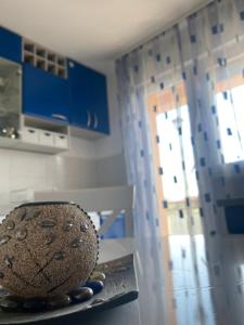 a bowl sitting on a counter in a kitchen at Apartman “IVA” in Drvar