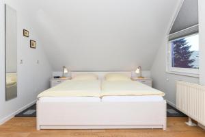 Postel nebo postele na pokoji v ubytování Ferienwohnungen Haus Sternenlicht