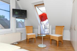 TV a/nebo společenská místnost v ubytování Ferienwohnungen Haus Sternenlicht