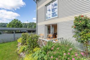 Zahrada ubytování SEASIDE APARTMENTS - BOATHOUSE