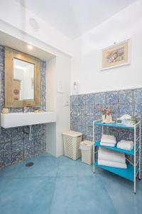 a bathroom with a sink and a mirror at La Bella Annacapri in Anacapri