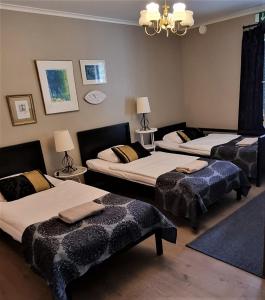 Кровать или кровати в номере Wanha Neuvola Guesthouse & Apartment