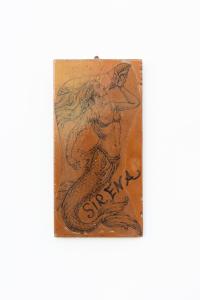 a drawing of a mermaid on a piece of paper at La Bella Annacapri in Anacapri