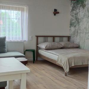 Postel nebo postele na pokoji v ubytování Apartamenty Heweliusz House