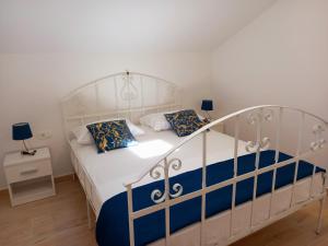 Posteľ alebo postele v izbe v ubytovaní Apartman La Marija