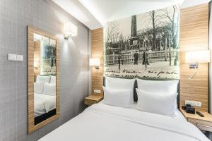 Posteľ alebo postele v izbe v ubytovaní Hotel Wieniawski + 37 fotografií