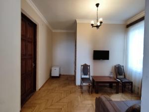 TV o dispositivi per l'intrattenimento presso Guesthouse White Swan