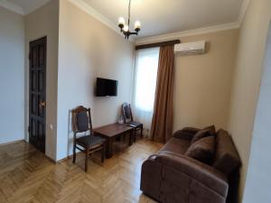 TV o dispositivi per l'intrattenimento presso Guesthouse White Swan