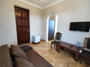TV o dispositivi per l'intrattenimento presso Guesthouse White Swan