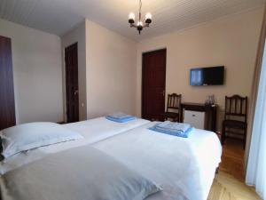 Letto o letti in una camera di Guesthouse White Swan