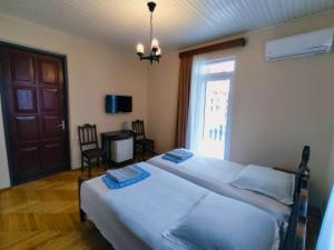 Letto o letti in una camera di Guesthouse White Swan