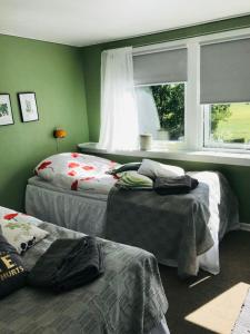 En eller flere senge i et værelse på B & B Mølgaard by Skjern
