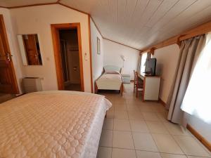 Ein Bett oder Betten in einem Zimmer der Unterkunft Villa Riva