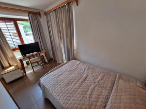 Ein Bett oder Betten in einem Zimmer der Unterkunft Villa Riva