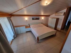 Ein Bett oder Betten in einem Zimmer der Unterkunft Villa Riva