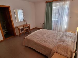 Ein Bett oder Betten in einem Zimmer der Unterkunft Villa Riva