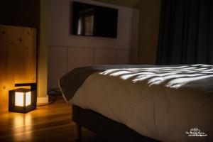Posteľ alebo postele v izbe v ubytovaní Logis Hôtel Altitude et Spa Pierre-Percée