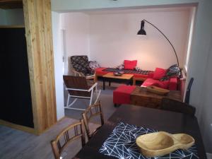 a living room with a couch and a table at Apartman HF in Liberec