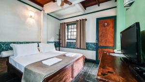 Cama ou camas em um quarto em Pousada Monte Azul