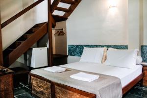 Cama ou camas em um quarto em Pousada Monte Azul