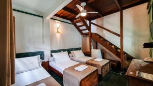Cama ou camas em um quarto em Pousada Monte Azul