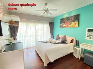 Postel nebo postele na pokoji v ubytování Thalassa pool Kata Beach