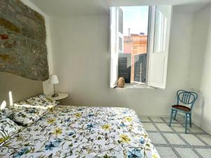 Postel nebo postele na pokoji v ubytování Via Roma House Carloforte